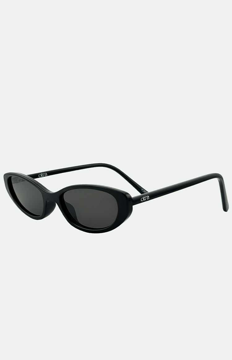 Angled view of black thin cat-eye sunglasses with dark lenses and visible temple arms