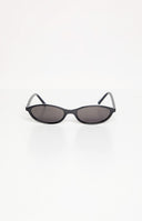 brunette model wearing black cateye frames sunglasses with smokey black lenses