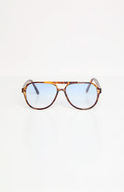 Front view of tortoiseshell aviator sunglasses with a double bridge and light blue gradient lenses