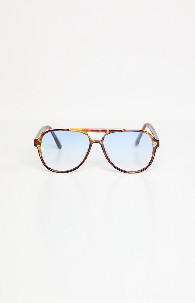 Front view of tortoiseshell aviator sunglasses with a double bridge and light blue gradient lenses