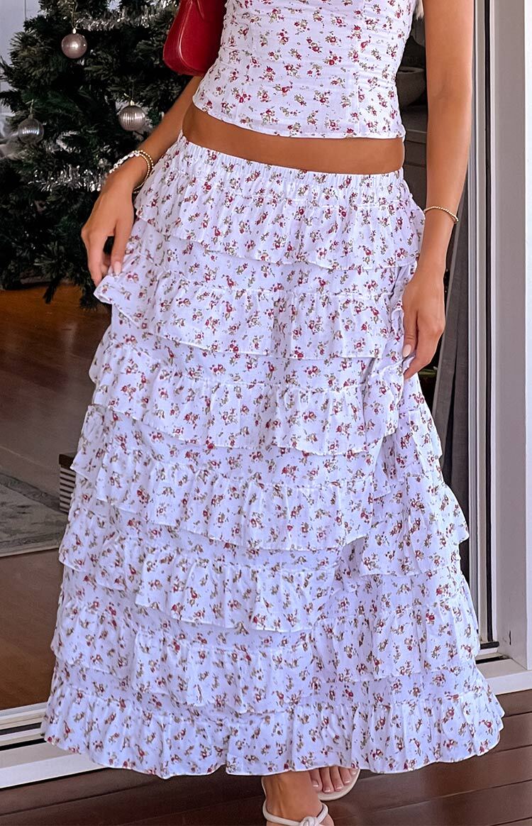 Front view of the white floral print maxi skirt with five tiers of flowing ruffles and a relaxed fit