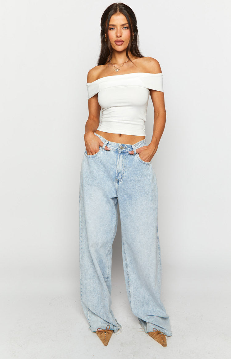 White off-shoulder cropped top with a wide fold-over neckline and fitted silhouette