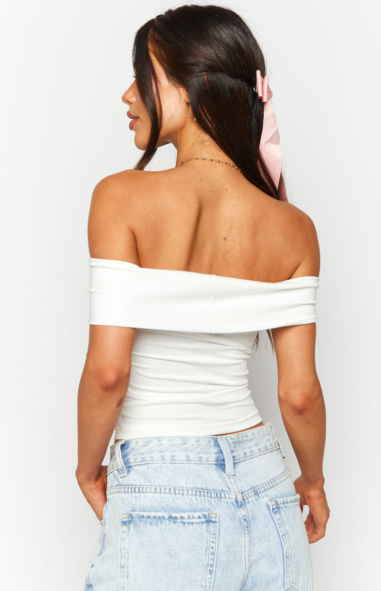 Rear view of a white off-shoulder top with a wide folded neckline and fitted body