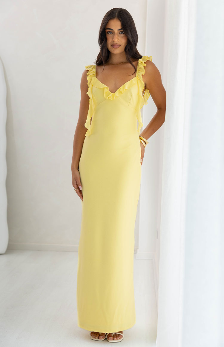 Yellow formal maxi dress featuring a V-neckline and layered ruffles on the shoulder straps and bodice