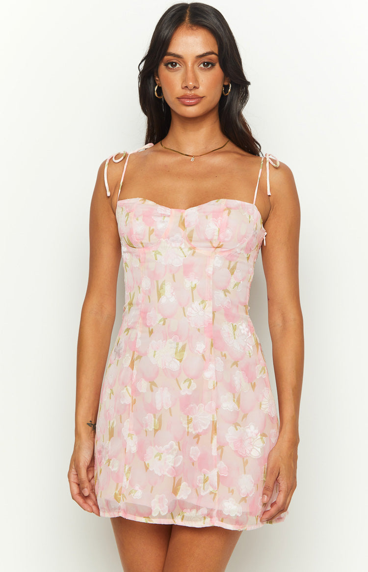 Pink floral mini dress with a sweetheart neckline and delicate tie-up spaghetti straps