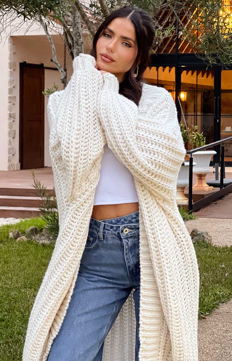 Cream chunky knit longline cardigan with thick ribbed texture and wide cuffs