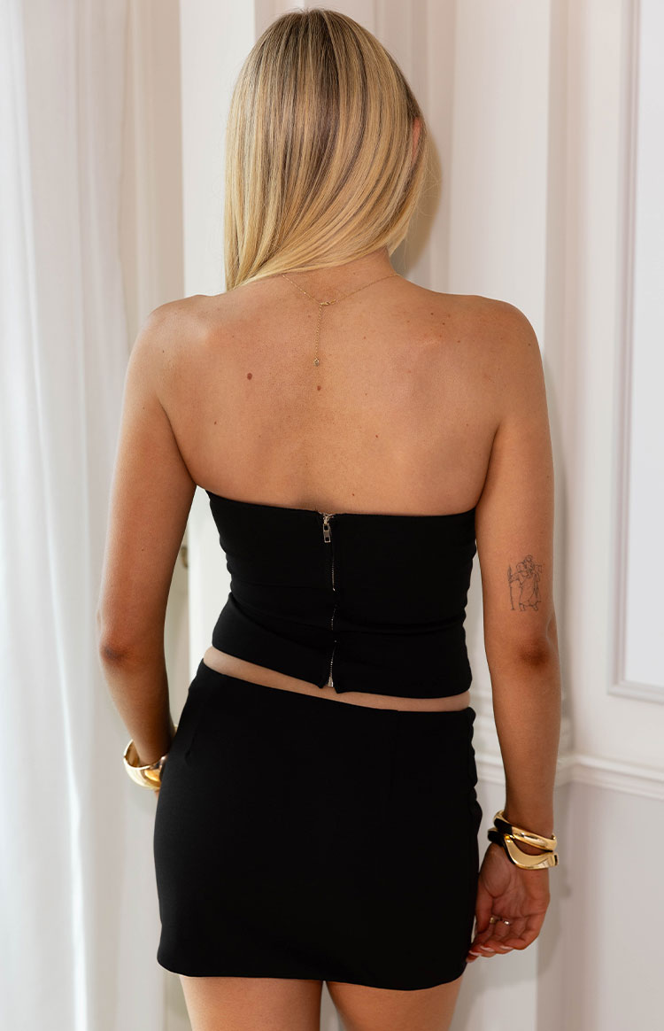 Rear view of the black strapless corset top with a full-length back zipper
