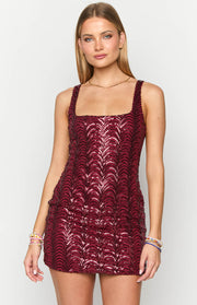 Red sequin mini dress with a square neckline and an intricate wavy sequin design