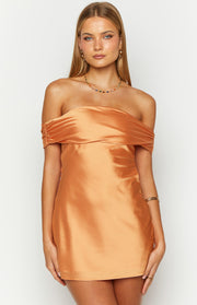 Front view of an orange satin off-the-shoulder mini dress with ruched detailing on the sleeves