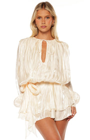 Pearl satin long sleeve mini dress with keyhole tie neckline, blouson bodice, and ruffled skirt