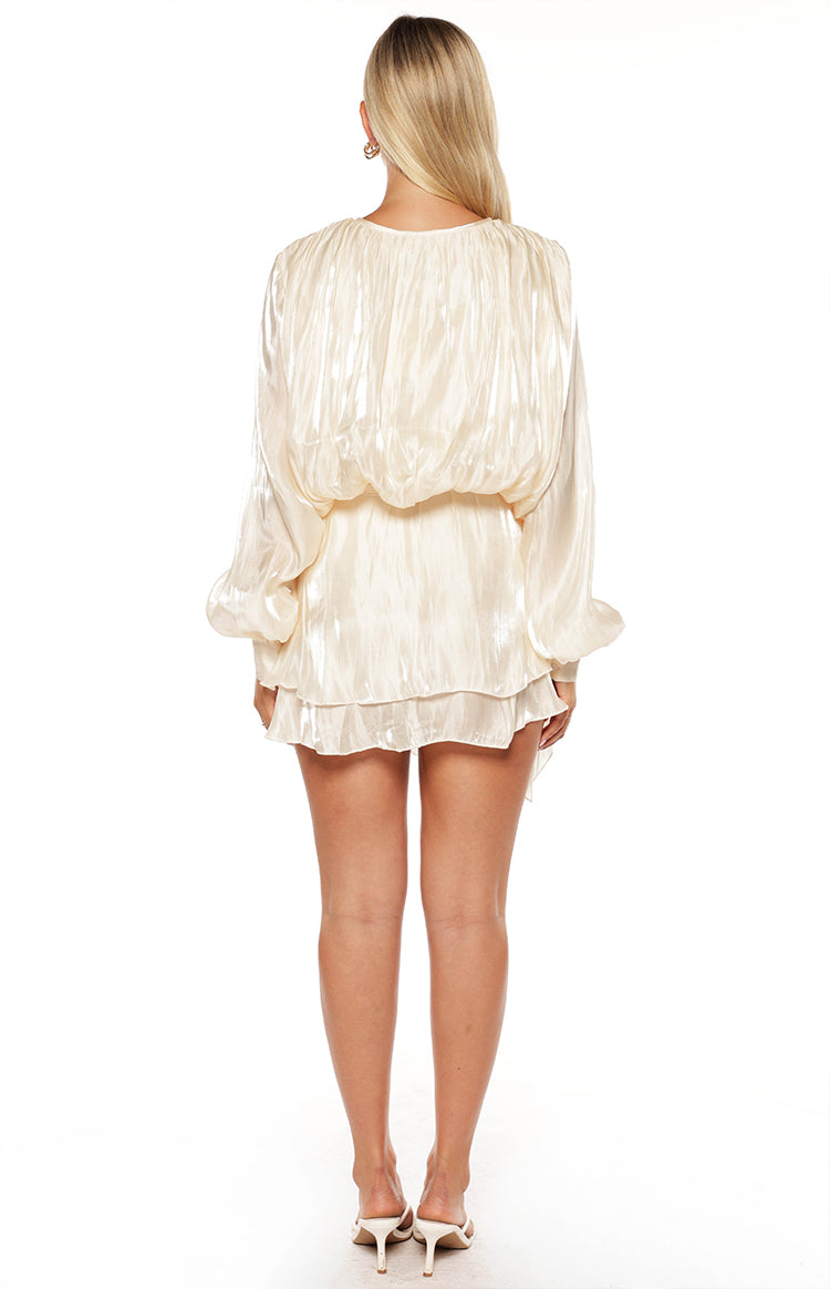 Rear view of a pearl crinkled satin mini dress with a blouson top, gathered waist, and tiered ruffled skirt