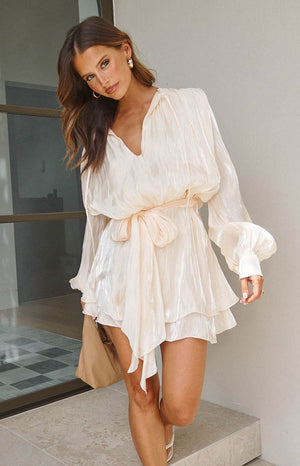 Beginning Boutique Quinton Pearl Satin Long Sleeve Tie Mini Dress pearl crinkled satin V-neck mini dress with voluminous long sleeves, tie waist, and layered ruffled skirt