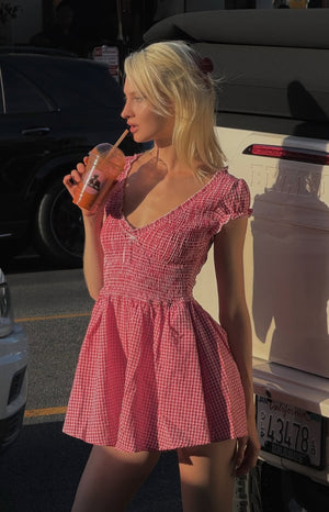Beginning Boutique Raldo Red Gingham Playsuit red gingham V-neck playsuit with shirred bodice, puff sleeves, and flared mini