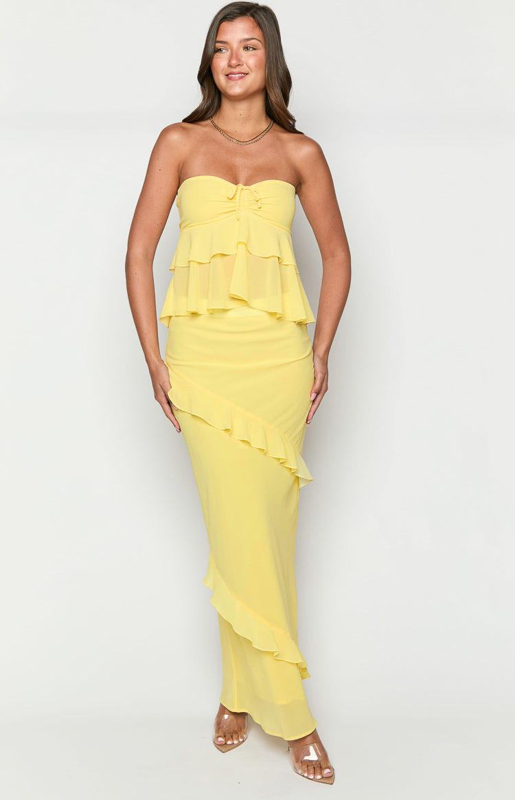 Front view of a yellow strapless top in sheer chiffon with a tie-front bust and tiered ruffle layers