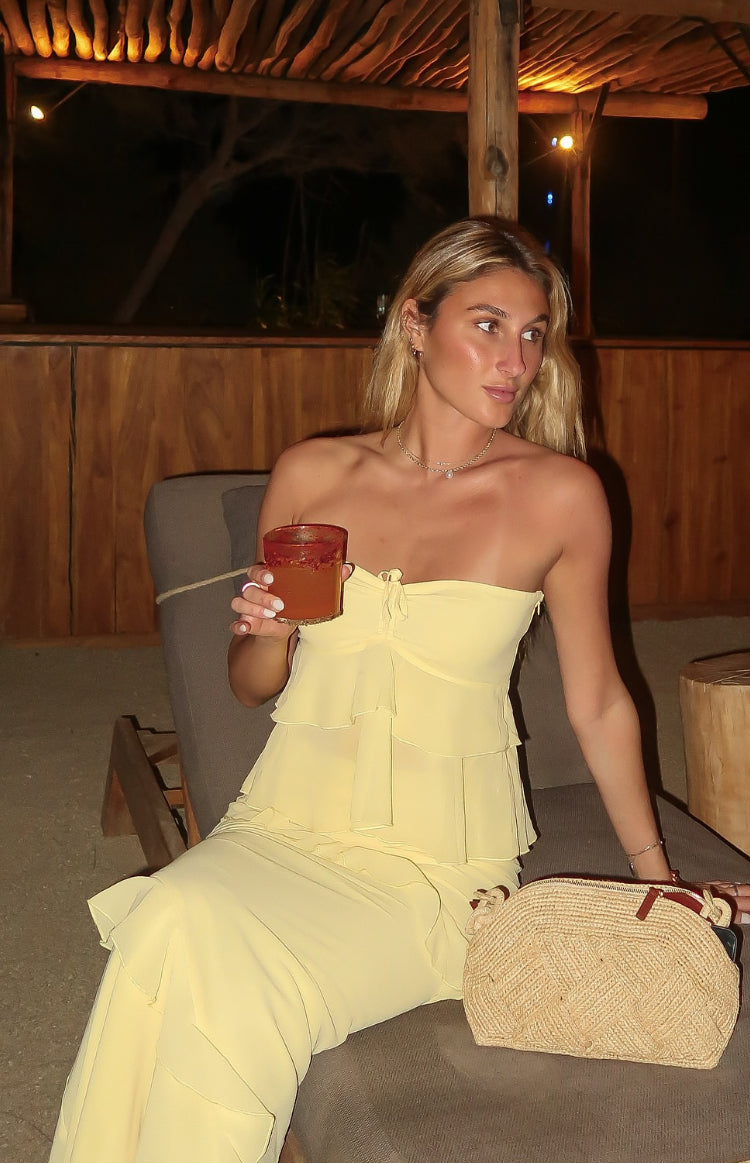 Yellow maxi skirt with tiered ruffles and a soft flowing drape