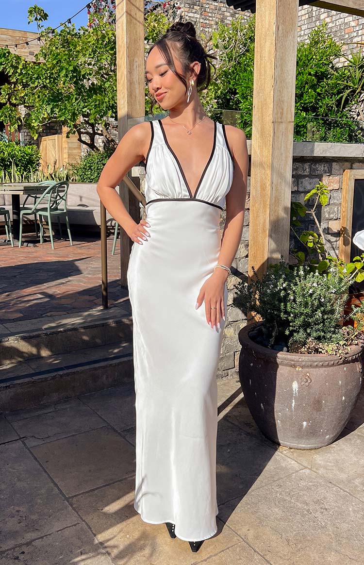 Beginning Boutique Rebel Rose Black And White Contrast Maxi Dress white satin deep V-neck with black contrast trim and ruched empire waist