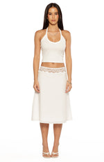 Front view of a white midi skirt with delicate lace trim at the high waist