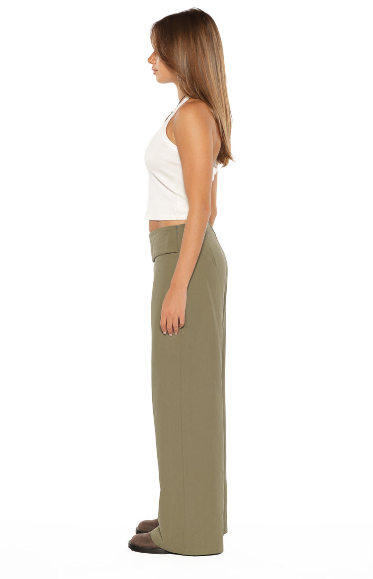 Side view of green straight leg pants with a high-waisted fit and smooth drape