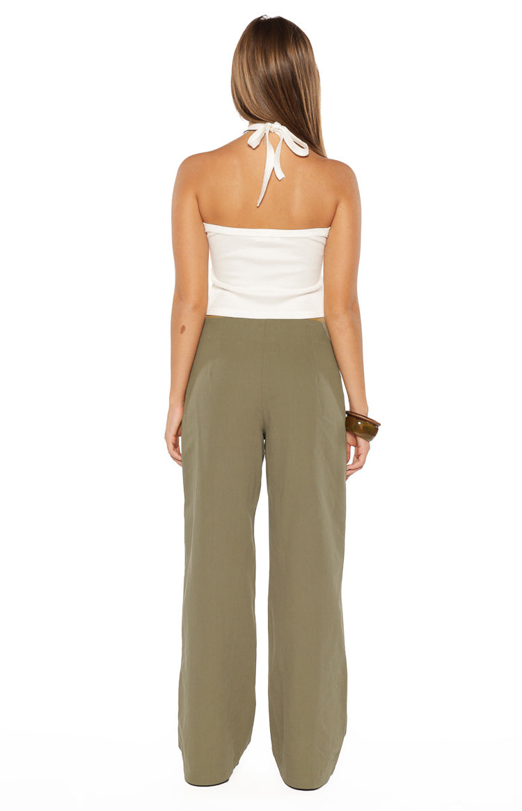Rear view of the green straight leg pants showing the relaxed fit and smooth fabric from behind
