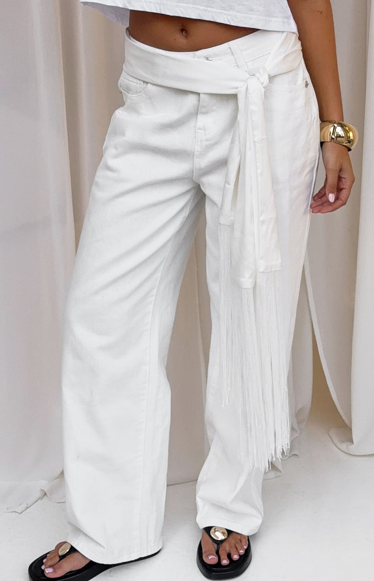 White satin fringe scarf belt tied around the waist with long tassels hanging down
