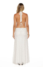 Rear view of a white mesh maxi skirt with dark polka dots and a ruched waistband detail
