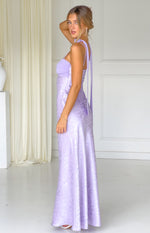 Side view of a lilac floral satin maxi dress with long scarf straps and a fitted bodice