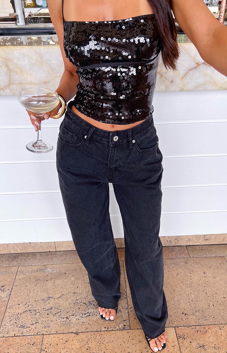 Washed black wide leg boyfriend jeans with a relaxed fit and mid-rise waist