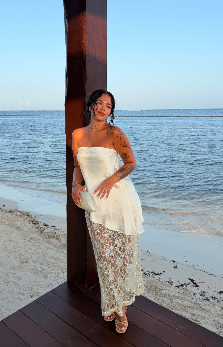 Full length pale yellow sequin lace maxi skirt with a sheer overlay and sparkling sequins