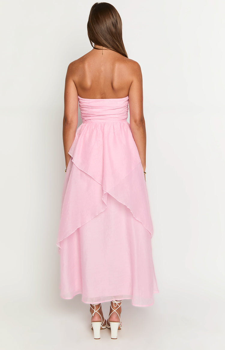 Rear view of a pink strapless maxi dress with a ruched bodice and tiered layered skirt