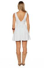 Rear view of a blue and yellow check sleeveless mini dress with a deep V-neck back and zipper