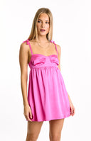 A radiant hot pink satin mini dress- designed with a ruched bust and sweet tie-shoulder straps- offering a playful and eye-catching look for a party or dance.