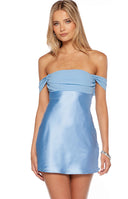 Model wearing a baby blue satin mini dress with a stunning contrast chiffon bust and off shoulder neckline. This elegant mini dress is perfect for homecoming and semi formal occasions