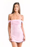 A female model wearing a pastel pink off-the-shoulder mini dress with a draped chiffon-like detail across the bust.
