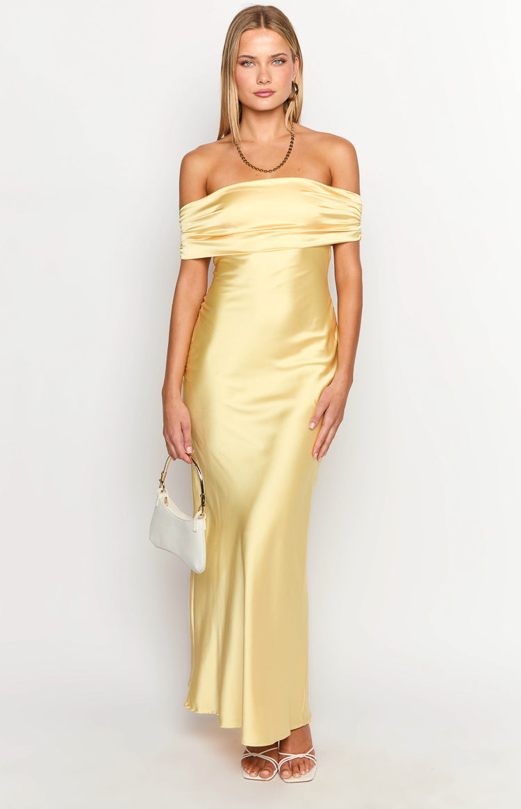 Front view of a yellow satin off-the-shoulder maxi dress with a draped neckline and fitted silhouette