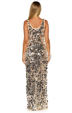 Rear view of a silver sequin maxi dress with a scoop back neckline and nude mesh base