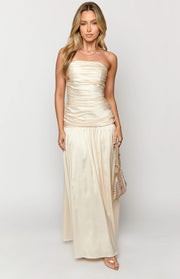 Cream satin strapless maxi dress with a ruched bodice and a flowing skirt