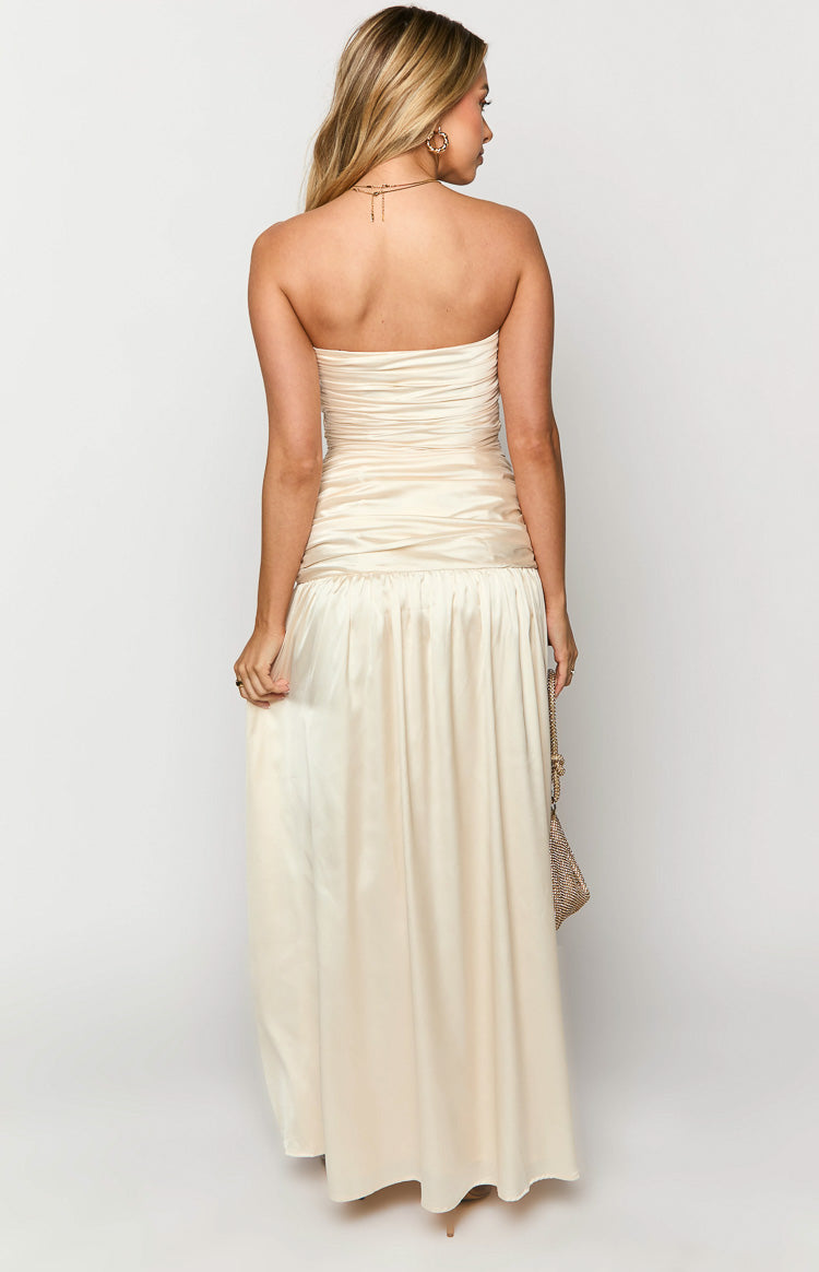 Rear view of a cream satin strapless maxi dress with a ruched bodice and gathered waist seam