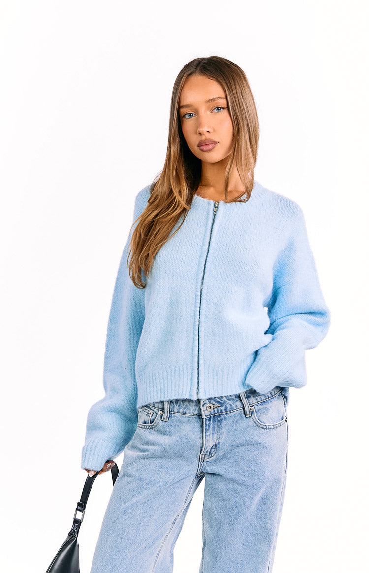 Light blue fluffy knit cardigan with a round neck and full-length silver zip closure