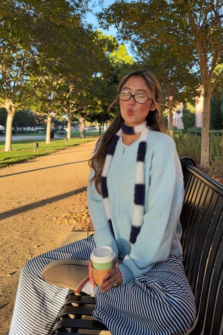 Light blue chunky knit cardigan with a full zip front and long relaxed sleeves