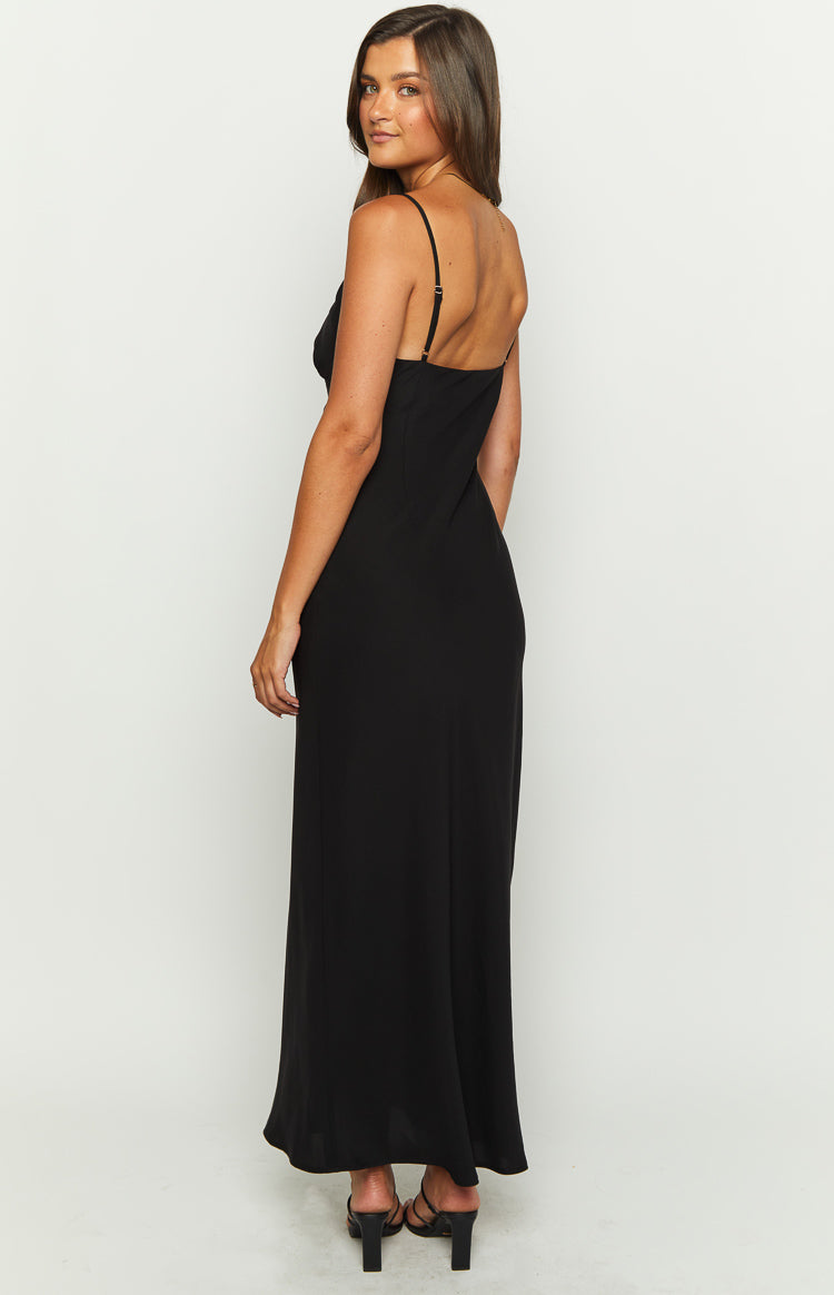Side view of a black maxi dress with thin adjustable spaghetti straps and a low back
