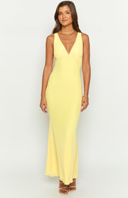 Front view of a sunflower yellow mesh maxi dress with a deep V-neck and ruched bust detail