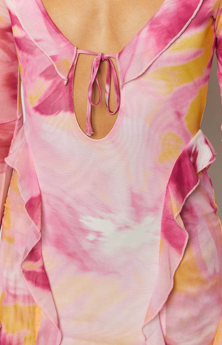 Close-up of the back keyhole cutout with tie detail and ruffled trim on the pink tie-dye mesh mini dress