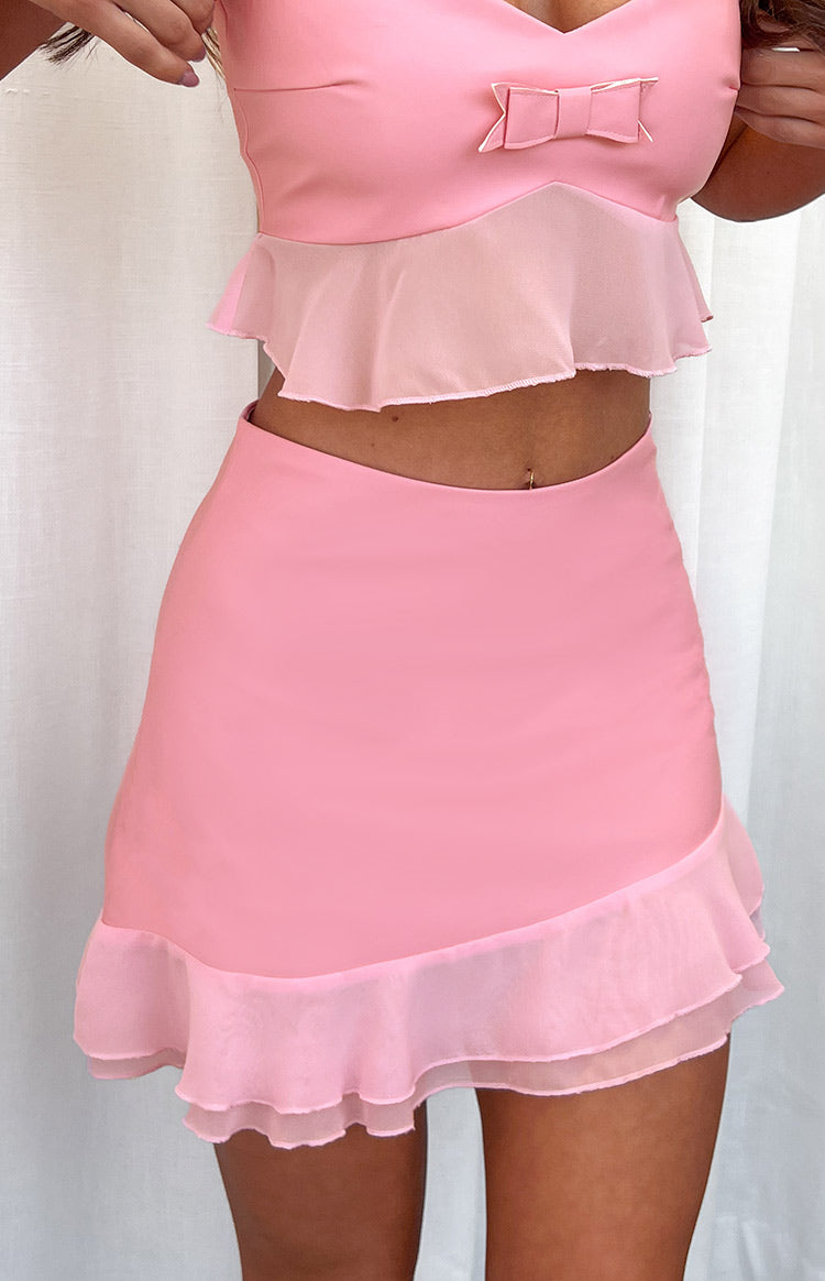 Beginning Boutique Sweetest Pink Mini Skirt pink mini skirt with a fitted silhouette and a layered ruffled hem