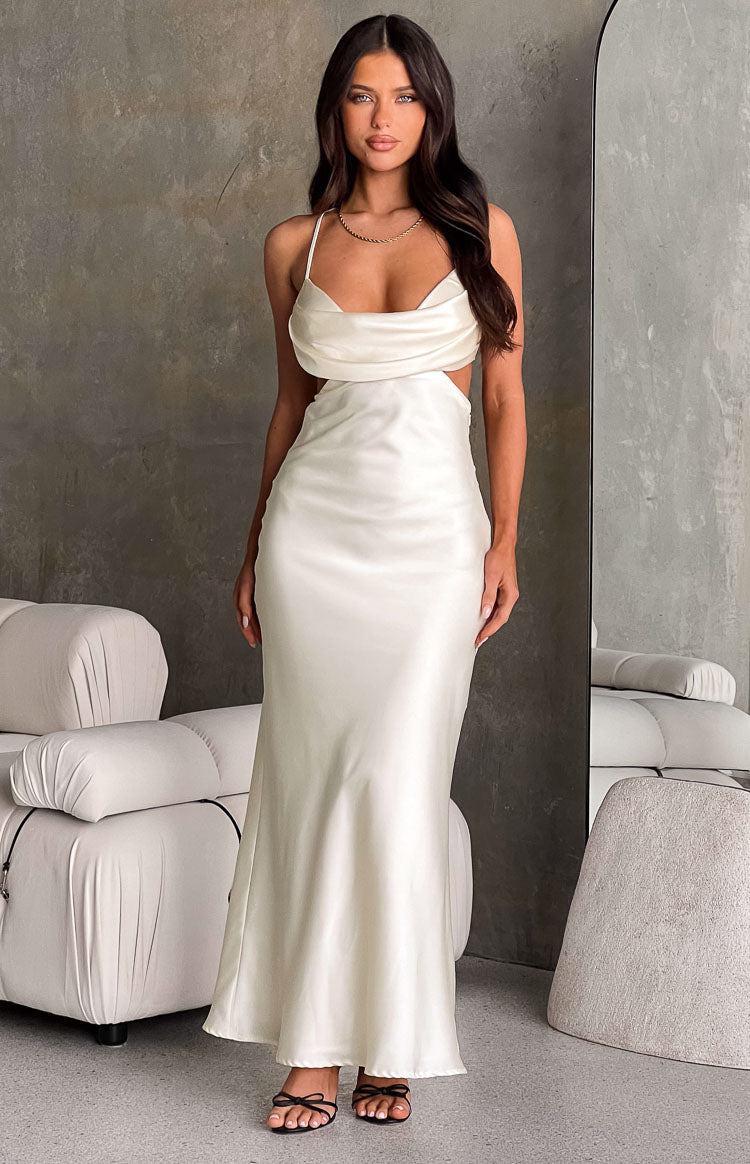 Cream satin cowl neck maxi dress with thin spaghetti straps and waist cutouts