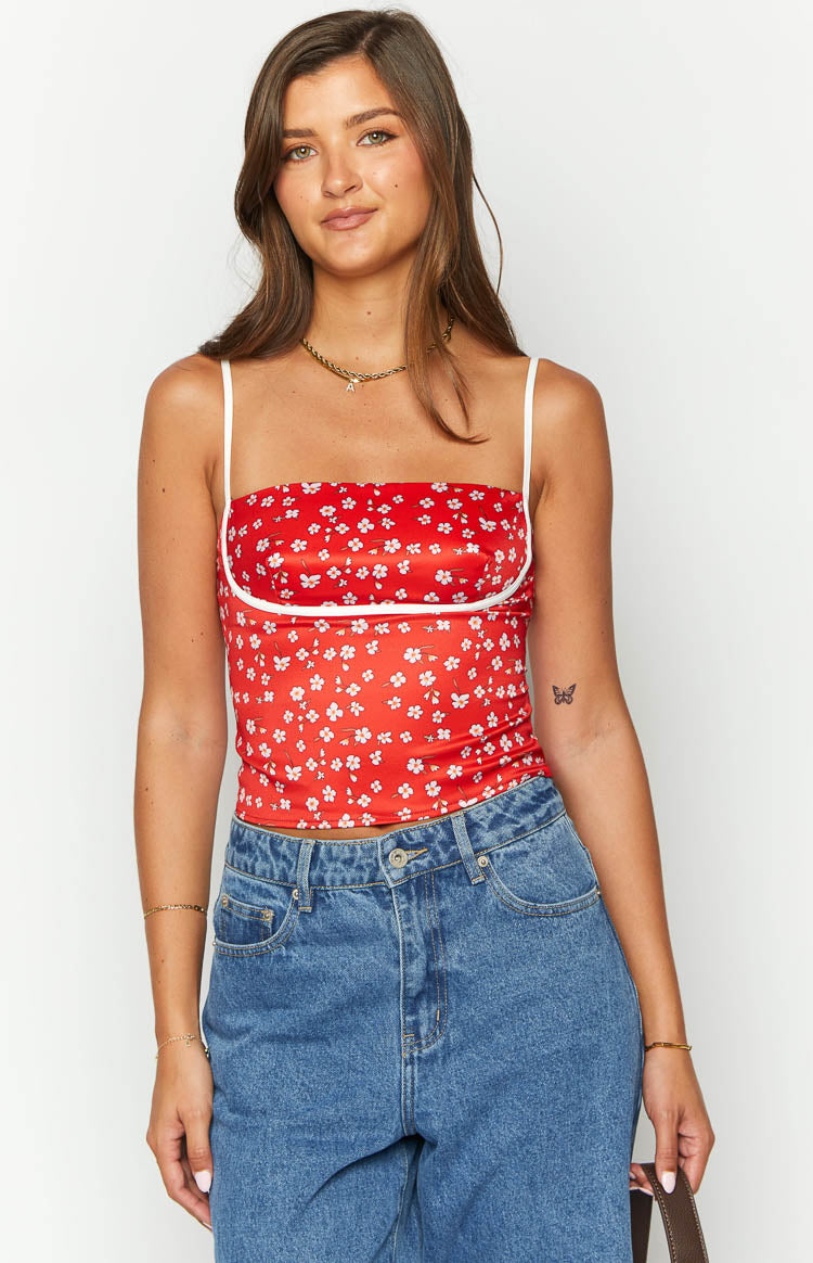 Red floral crop top featuring a square neckline, thin white spaghetti straps, and white underbust piping
