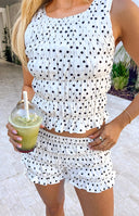 Beginning Boutique Tango White Polka Dot Shorts white textured polka dot high-waisted shorts with ruffled hem