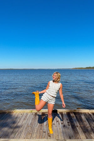 Beginning Boutique Tango White Polka Dot Shorts white textured polka dot high-waisted shorts with ruffled hem