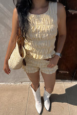 Yellow and white small gingham shorts with multiple tiered ruffles and a relaxed fit