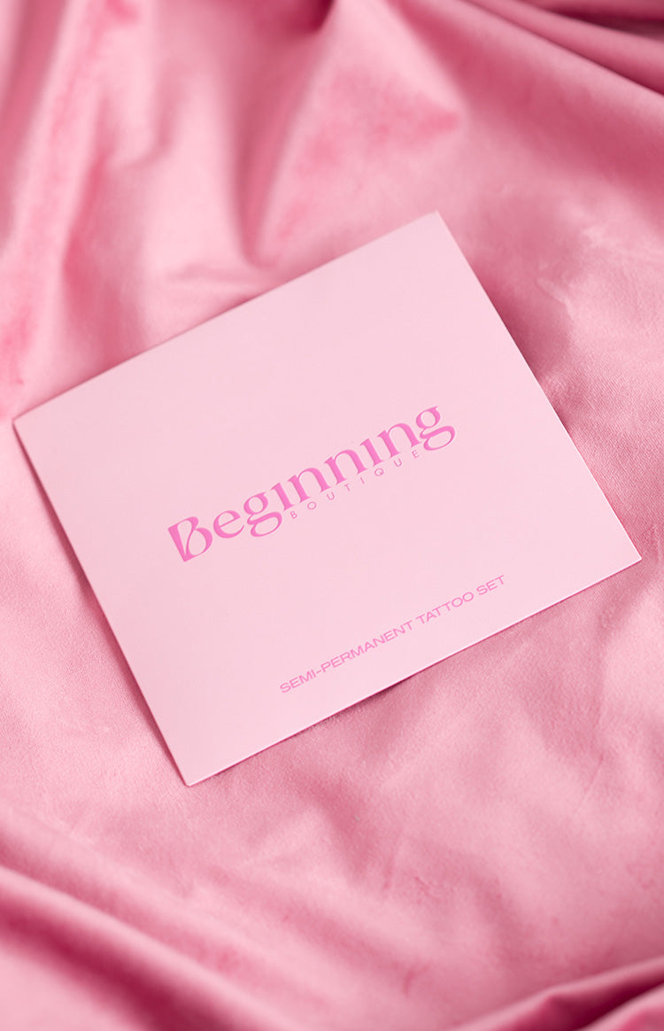 Pink square card for semi-permanent tattoos, featuring 'Beginning Boutique' and 'SEMI-PERMANENT TATTOO SET' text