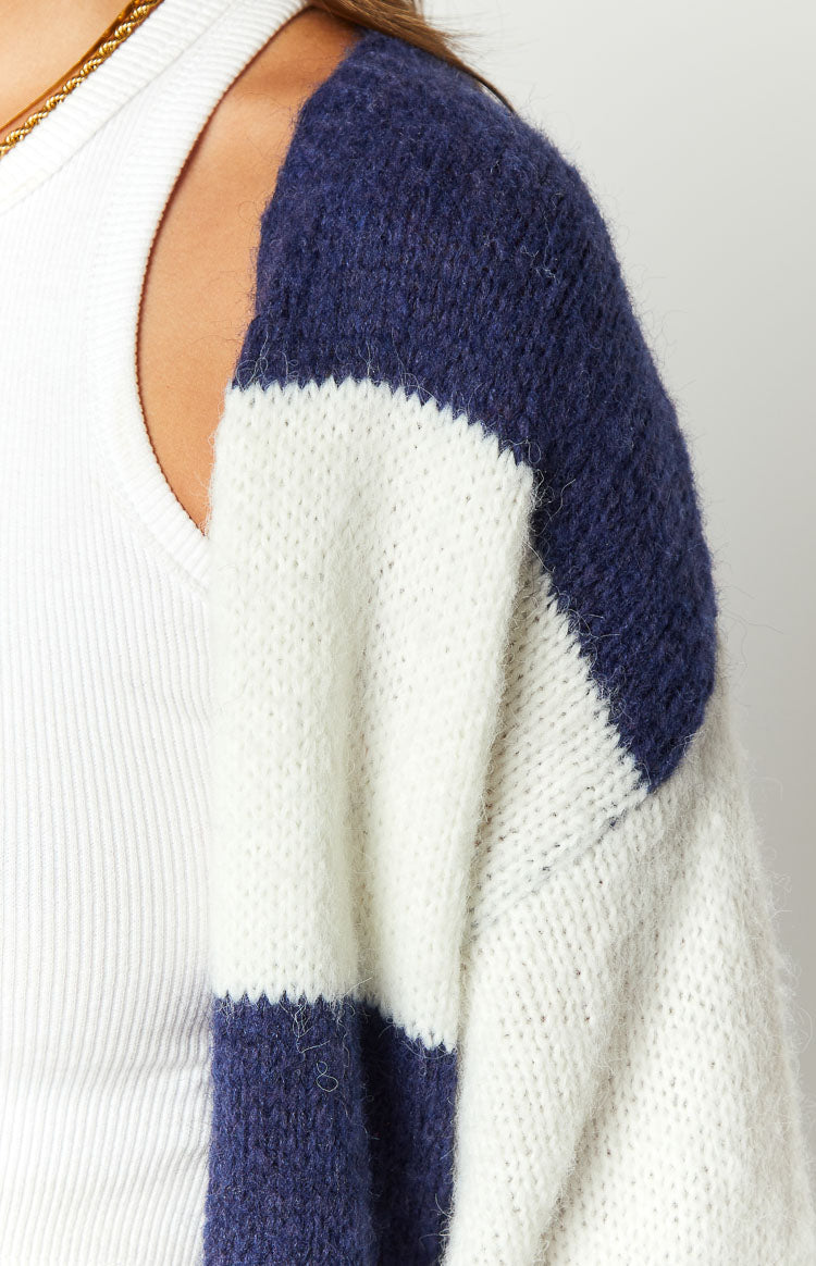 Close-up of the blue and white striped knit cardigan, highlighting the fuzzy texture